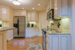 Fully Equipped Kitchen with Granite Countertops & Stainless Steel Appliances